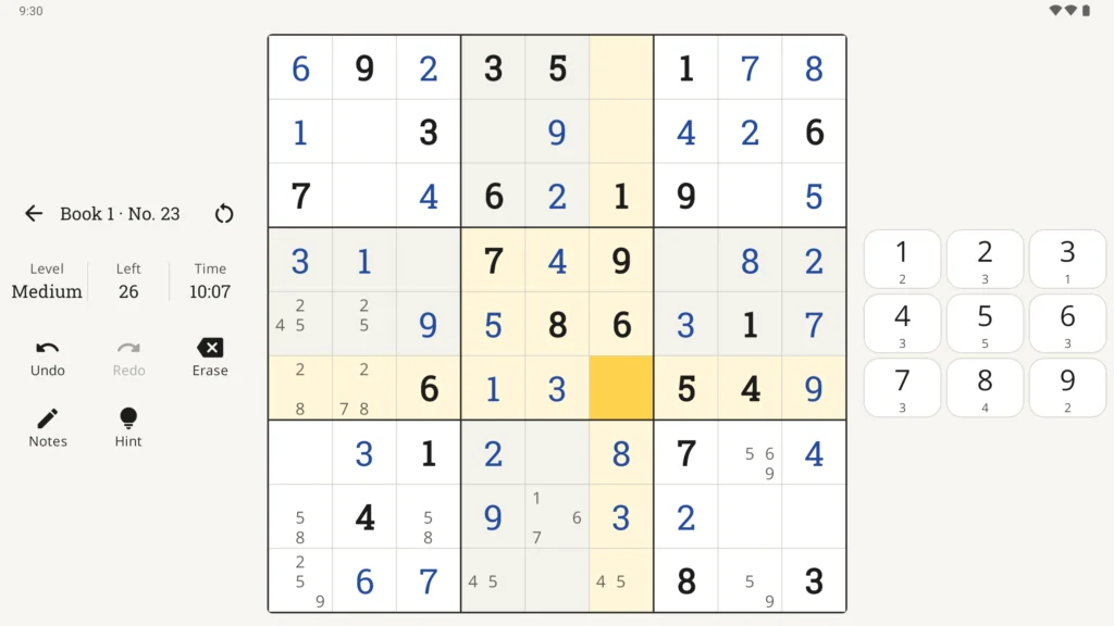 NineSquare on a tablet in landscape: the grid centred, tools on the left and the keypad on the right